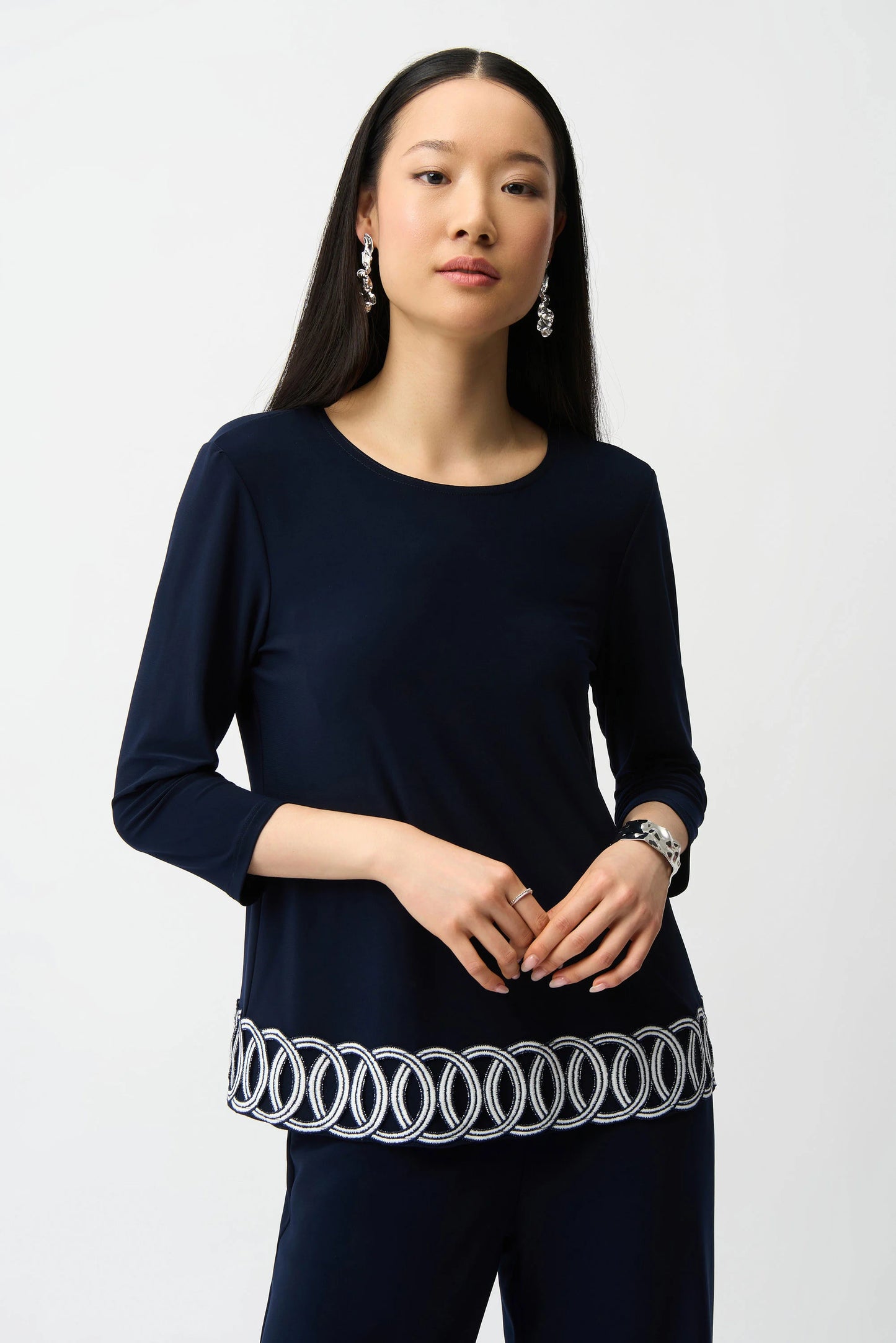 Silky Knit Fitted Top With Guipure Hem Detail
261069